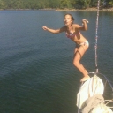 Arielle jumping of the bow of the Mac 22