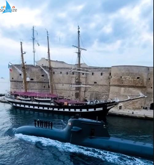 Passage of a Submarine with Palinuro Ship docked at the castle.A passage through the navigable canal in Taranto, Italy.